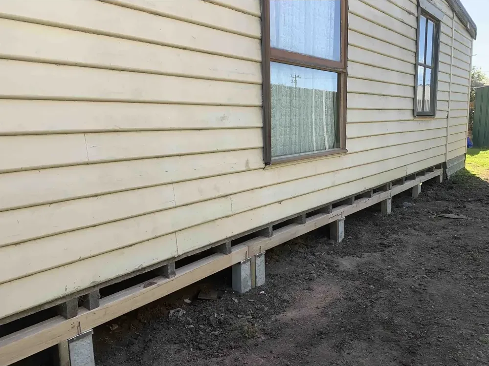 Exterior of weatherboard home reblocked back to level